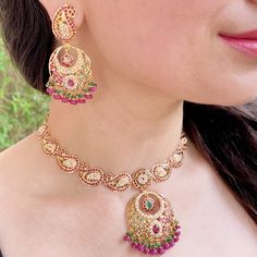 Featuring a paisley design necklace with chandbali earrings in 22ct gold. The set has been embellished with rubies, emeralds and pearls. The necklace weighs 33.8 GMs including 2.77 GMs of hanging beads. The earrings weigh 18.33 GMs including 3.36 GMs in hanging beads. Watch Video Here Ornate Gold Danglers With Meenakari, Multicolor Meenakari Gold-plated Necklaces, Ornate Gold Kundan Danglers, Ornate Meenakari Yellow Gold Necklace, Ornate Gold Meenakari Necklace, 22k Gold Jewelry Necklaces, Hanging Beads, 22k Gold Jewelry, Chandbali Earrings