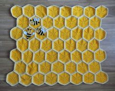 a crocheted rug with bees on it