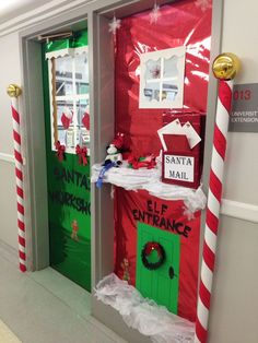 two doors decorated to look like santa's workshop for the elf in the hallway