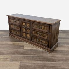 a large wooden dresser sitting on top of a hard wood floor