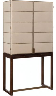 a tall cabinet with two doors and some drawers