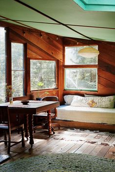 a room with wood paneling and wooden floors