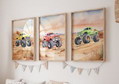 three paintings of monster trucks hanging on the wall above a bed in a room with white walls