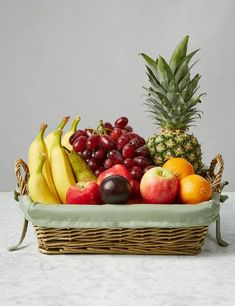 a basket filled with lots of different types of fruit