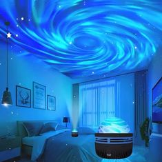 a bedroom decorated in blue and white with a ceiling painted like a spirally swirl