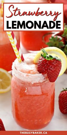 strawberry lemonade in a mason jar with strawberries and lemons on the side