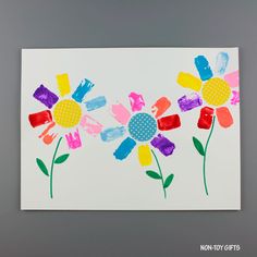 an art project for kids with flowers painted on paper and colored crayon paint