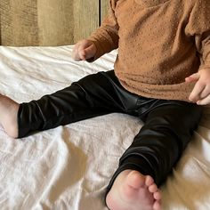 All that's missing is a pair of Dr. Martens, am I right?! Your baby girl will be the most fashionable in these Pleather Leggings. We think our Swiss Dot Tunic (pictured) with them is the perfect combo🖤snag these for your edgy babes⚡️ Cute Fitted Pants For Playtime, Fitted Casual Pants For Playtime, Casual Fitted Pants For Playtime, Playful Fitted Pants For Playtime, Cute Fall Bottoms For Playtime, Stretch Footless Leggings For Playtime, Cute Stretch Leggings For Fall, Cute Fall Playtime Bottoms, Playful Footless Bottoms For Playwear