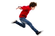 a young boy is jumping in the air