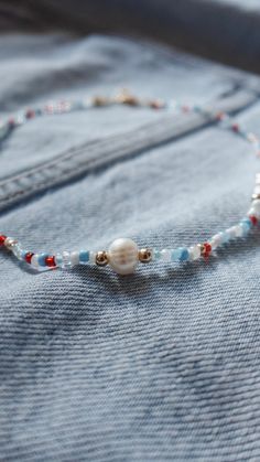 ☆ Party like it’s 1776. ☆

This is an approximately 16-inch (40.64 centimeter) red/white/blue pearl beaded necklace with 3mm assorted blue beads, 3mm red beads, 3mm assorted white beads, 3mm gold accent beads, 4-5mm diameter freshwater white pearls, with a centered 8mm accent freshwater white pearl surrounded by 4mm 18k gold filled beads. The clasp is 18k gold plated with a 2-inch (5.08 centimeter) extension chain. The necklace is strung using durable beading wire. White Beaded Bracelets For 4th Of July Gift, 4th Of July White Beaded Bracelets Gift, Everyday Red Jewelry With Colorful Beads, Red Tiny Beads Necklace For Summer, Summer Red Necklace With Beaded Chain, Red Necklaces With Round Letter Beads, Red Round Bead Necklaces For Everyday, Everyday Red Round Bead Necklaces, Everyday Red Round Bead Necklace