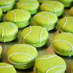 tennis ball cookies with green frosting and white sprinkles