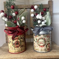 two tin canisters with christmas decorations on them