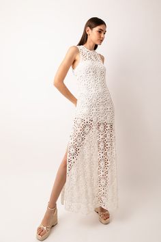 This crochet lace maxi dress features a round neck, sleeveless design, side slits, and detachable lining, with an exposed button fastening at the back. Experience the beauty and elegance of this stunning dress and add a touch of sophistication to your wardrobe. 100% Cotton. Lining: 82% Nylon, 18% Elastane.  Cool hand wash. Brand Magazine, Blazer With Jeans, Lace Maxi, Dress Medium, Sorrento, Lace Maxi Dress, White Crochet, Dress C, Independent Designers Fashion