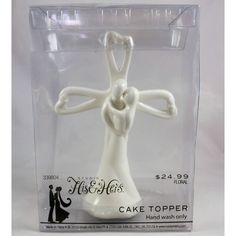 a white cake topper in a plastic package