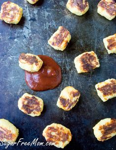 some food that is on top of a pan with ketchup in the middle