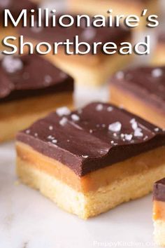 chocolate and peanut butter squares are arranged on a white surface with other desserts in the background