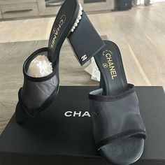 Chanel 22a Black Mesh Pearl Cc Logo Block Heel Backless Mule Sandal Pump 39********** Chanel ********** Brand: Chanel Size: 39 (Know Your Chanel Size) Name: Mules Color: Black Style: Block Heel Sandals Style#: G39252 X56688 94305 Season: 22a Material: Mesh, Suede Calfskin These Have Never Been Worn And Sitting In My Closet. Retail Price Is In Photos And You Can No Longer Get. Comfortable Thick Block Heel. Pearl Around Back Heel Trim Cc Inside Heel Pearl Logo Black Suede Calfskin And Mesh Materia Designer Slip-on Party Sandals, Evening Slip-on Heels With Contrasting Heel Counter, Luxury Slip-on Heels For Evening, Designer Slip-on Heels For Evening, Designer Medium Width Party Heels, Medium Width Slip-on Sandals For Evening, Designer Heels With Removable Insole, Luxury Black Synthetic Heels, Luxury Summer Slip-on Heels