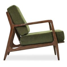 a green chair sitting on top of a wooden frame