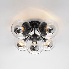 an image of a ceiling light that is in the middle of the room with three lights on it