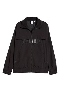 This relaxed-fit track jacket is part of a collab with PLEASURES and is inspired by a clash of racing and punk-inspired streetwear. Bold tonal branding for both labels subtly reflects against the sleek nylon on the outerwear, while underarm ventilation keeps it breathable throughout the day. 28" length (size Medium) Front zip closure Stand collar Elastic cuffs and hem Side zip pockets Underarm ventilation Water-repellent 100% recycled nylon Machine wash, tumble dry Imported PUMA has received the Sporty Outerwear With Graphic Print For Sports, Sporty Windbreaker With Graphic Print For Streetwear, Sporty Graphic Print Outerwear For Sports Season, Fall Sports Track Jacket With Graphic Print, Sporty Fall Track Jacket With Graphic Print, Sports Outerwear With Logo Print For Fall, Fall Sports Outerwear With Logo Print, Sporty Graphic Print Windbreaker, Black Sports Outerwear With Logo Print