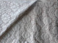 an image of a bed with white bedspread