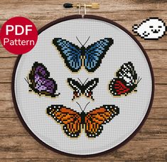 a cross stitch pattern with butterflies on it