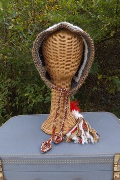 Unique crochet elf hood in brown, green, red & white earth tones and tasseled bottom.  Created from reclaimed yarns and fibers.1 of 1 Brown Crochet Hat For Festivals, Brown Hand Knitted Bohemian Crochet Hat, Brown Bohemian Crochet Hat Hand Knitted, Bohemian Brown Hand Knitted Crochet Hat, Bohemian Brown Hand-knitted Crochet Hat, Handmade Brown Bohemian Crochet Hat, Crochet Elf Hood, Earthy Crochet, Denim Cuff Bracelet