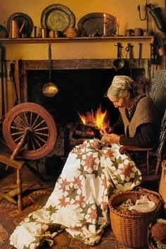 an old woman sitting in front of a fire