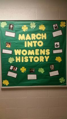 a bulletin board that says march into women's history with pictures and shamrocks on it