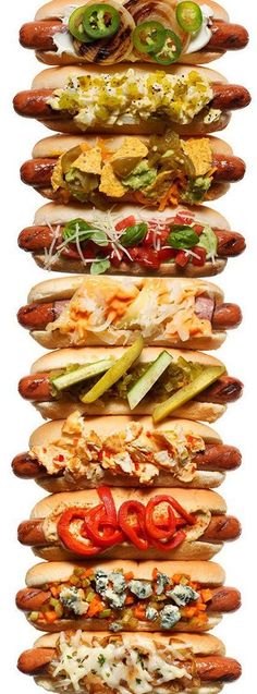 several hot dogs with different toppings are stacked on top of each other in the same row