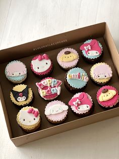 a box filled with cupcakes decorated like animals