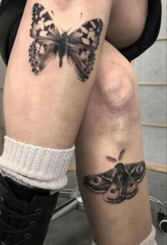 two butterflies on the legs of a woman