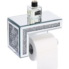 a glass table with a roll of toilet paper on it