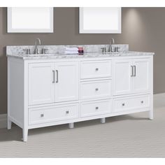 a white bathroom vanity with two sinks and mirrors on the wall next to each other