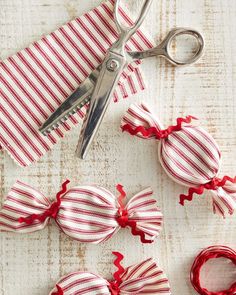 red and white striped fabric bows with scissors next to them