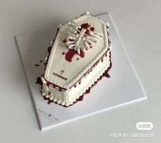 the cake is decorated with white icing and blood