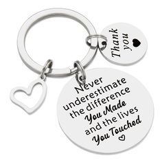 two key chains with the words never underestimate the differences you made and the lives you touched