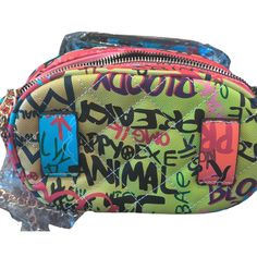 This stylish vegan leather bag features a trendy graffiti and quilted design and can be worn as a crossbody or waist bag. Product Details: Type: Fannypack/Waist bagComposition: Faux leather, metalColor: Multicolor (yellow/lime green)Strap Type: Chain, adjustable beltClosure: Top zipperMagnetic: NoPockets: Inner slip pocketEmbellished: N/ABag Size: SmallDimensions: 7.5L x 5H x 2.5WShips: 2-3 days Trendy Green Crossbody Belt Bag, Trendy Green Belt Bag With Zipper Closure, Trendy Green Belt Bag With Mobile Phone Pocket, Trendy Green Belt Bag With Mobile Phone Holder, Trendy Green Belt Bag With Phone Pocket, Trendy Green Belt Bag, Trendy Multicolor Crossbody Belt Bag, Trendy Mobile Phone Belt Bag, Trendy Multicolor Bag For Streetwear