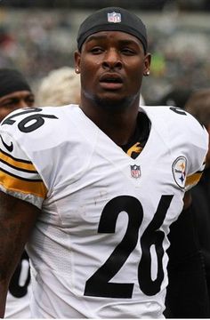 a close up of a football player wearing a uniform with the number 28 on it