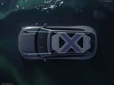 an overhead view of a car in the water