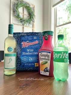 bottles of water, blueberries, and other items on a table