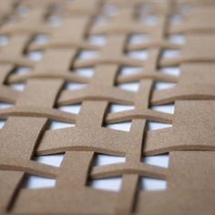 a close up view of a piece of wood with an intricate design on it's surface