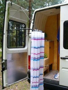 an open van door with a towel hanging from it's side and the back door opened