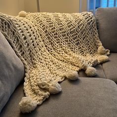 a couch with a blanket on top of it