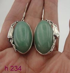 Description: Beautiful NEW earrings from my collection. Made of sculptural sterling silver with 18mm x 25mm jade stone inlaid in a beautiful saculptural 925 sterling silver frame.These are stunning new earrings, enjoy!Available in many other stones. Ask me...Stamped 925. This beauty will be sent to you in a gift package. (All stains, if are any, are due to camera). Please feel free to contact us for any matter.Metal: Sterling Silver 925 925Weight: 12.8Dimensions: Total Length: 42mm / 1.653 in. ( New Earrings, Jade Stone, Silver Frame, Stone Earrings, My Collection, Timeless Beauty, Silver 925, Jewelry Crafts, Natural Gemstones