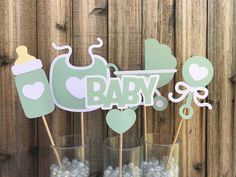 baby shower centerpieces with cupcake toppers and candy in glass vases