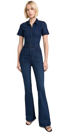 Find FREE PEOPLE Jayde Flare Jumpsuit on Editorialist. Fabric: Mid-weight, super-stretch denim. Collared neckline. Darting at waist. Short sleeves. Zip at front. Slant hip pockets. Shell: 92% cotton/6% polyester/2% elastane. Wash cold. Imported, Turkey. Measurements: Measurements from size XS Inseam: 33.75in / 86cm Leg opening: 20.5in / 52cm Fitted High-waist Elastane Jumpsuits And Rompers, Fitted Dark Wash Summer Jumpsuit, Fitted Dark Wash Jumpsuits And Rompers For Spring, Chic Fitted Dark Wash Jumpsuit, Fitted High Rise Denim Jumpsuit For Work, Dark Wash Fitted Overall Jumpsuits And Rompers, Fitted Dark Wash Jumpsuits And Rompers Overall, Fitted High Rise Jumpsuits For Workwear, Chic Fitted Denim Jumpsuit With Short Sleeves