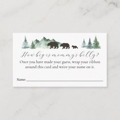 a business card with two bears in the woods on it, and an envelope for someone to write their name