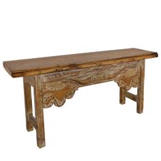 an old wooden table with carvings on the top and bottom, against a white background