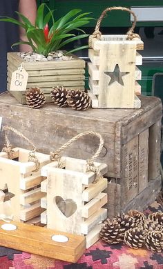 two wooden boxes with pine cones on top